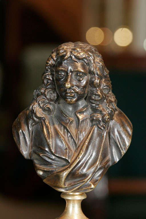 A pair of French bronze portrait busts on brass mounted marble columns.c.1820