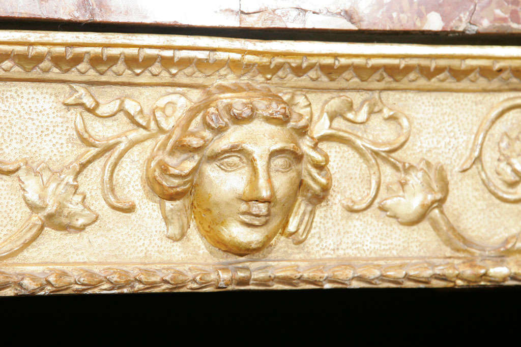 An important 18th.century Italian carved giltwood console table in the neo-classical manner,retaining the original veneered Sicilian Jasper marble top.