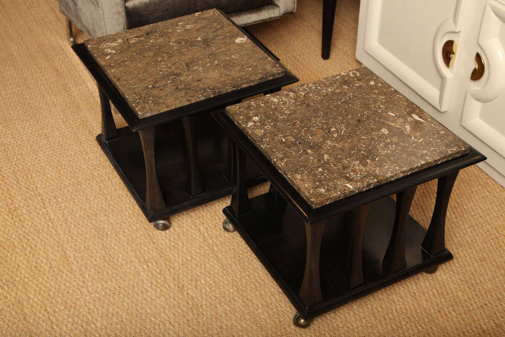 American Ebonized occassional tables with brown marble tops For Sale