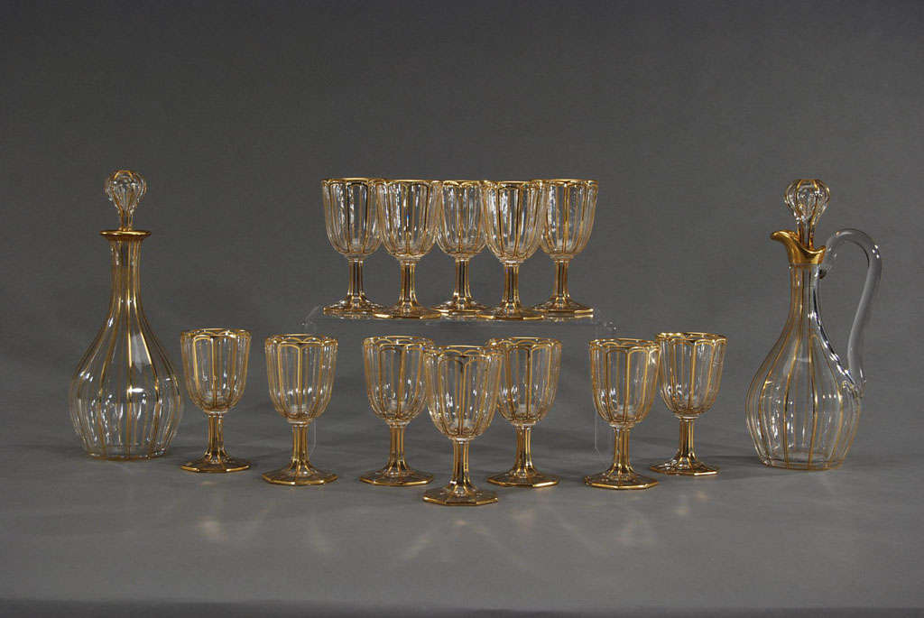 Serve dessert with this suite of gorgeous port goblets, made by Baccarat with panel cutting and elegant, gilded decoration. The octagonal foot, polished pontils and panel cut sides give these goblets a nice weight and the decorative gilding makes a