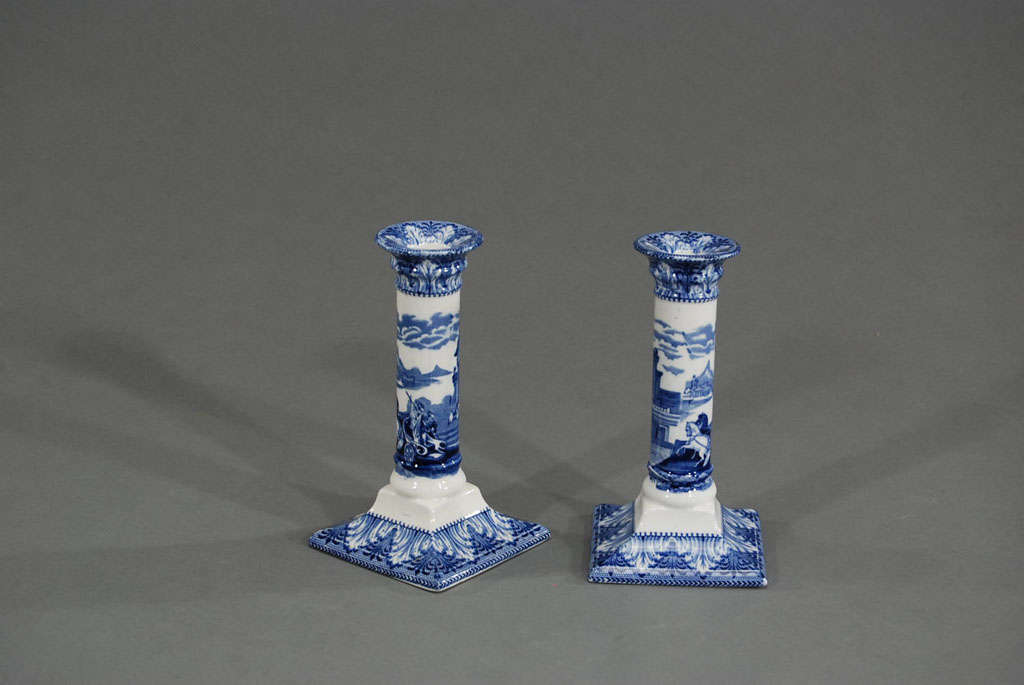 A wonderful pair of bold blue and white transfer decorated porcelain candlesticks. These would be a lovely compliment to a collection of plates and platters adding a 3-dimensional accent to any display. A casual blue and white table setting would be