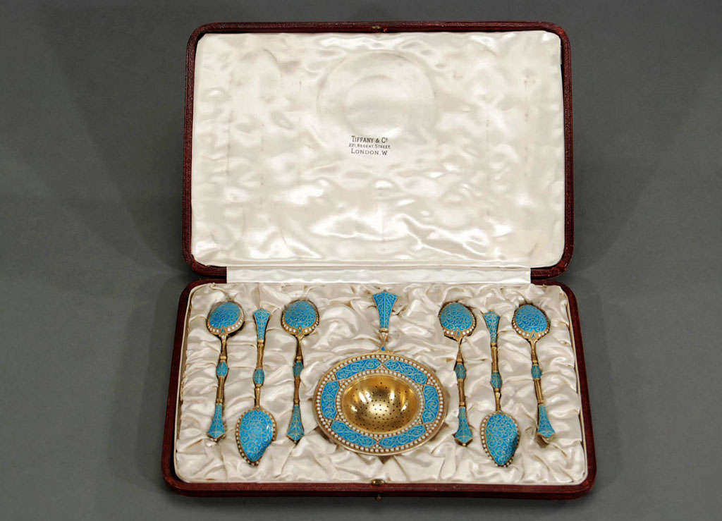 This perfect boxed set of Norwegian sterling silver tea strainer and matching 6 spoons were retailed by Tiffany & Co., London makes a beautiful presentation or gift. Original leather box with fittings to nestle the pieces in silk reveal the detailed