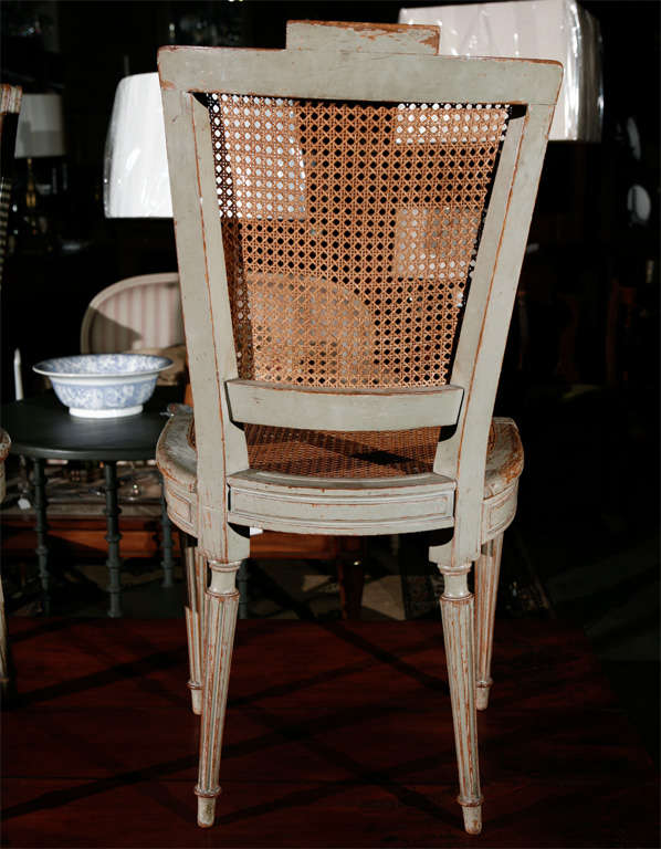 Cane Suite of Eight Antique Louis XVI Style Painted Dining Chairs For Sale
