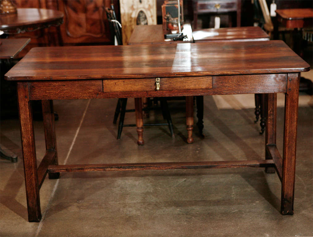 This table will be a pleasing asset in a well defined setting. It is French, early 19th century, strong in body and character. Imagine penning (or computing) a note to a old friend as the day slowly drifts by. Jefferson West Antiques offer a