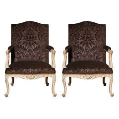 A Pair of Louis XV Carved Regence Fauteuils