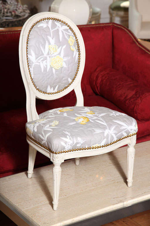 A Carved and Painted Louis XVI Petite Oval Chair