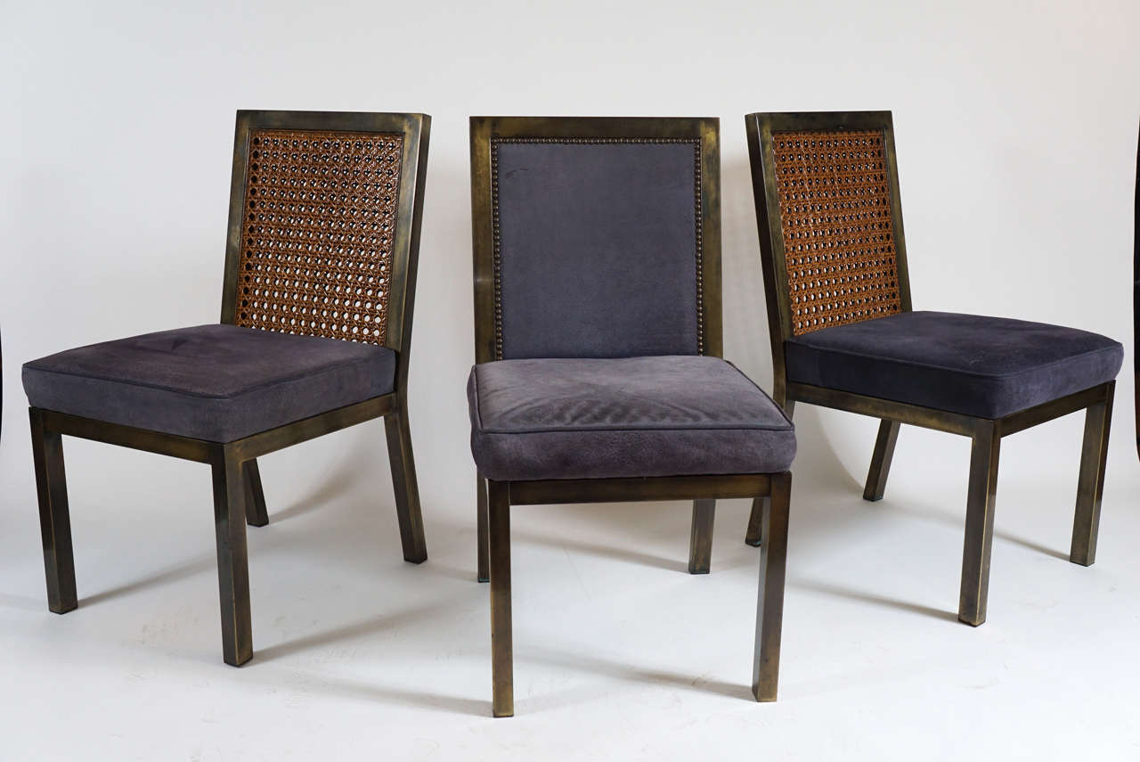 Original suite of six circa 1970 John Widdicomb bronze plated steel dining chairs; four with original double-sided woven rattan backs and two fully upholstered all in original purple suede. Chic.