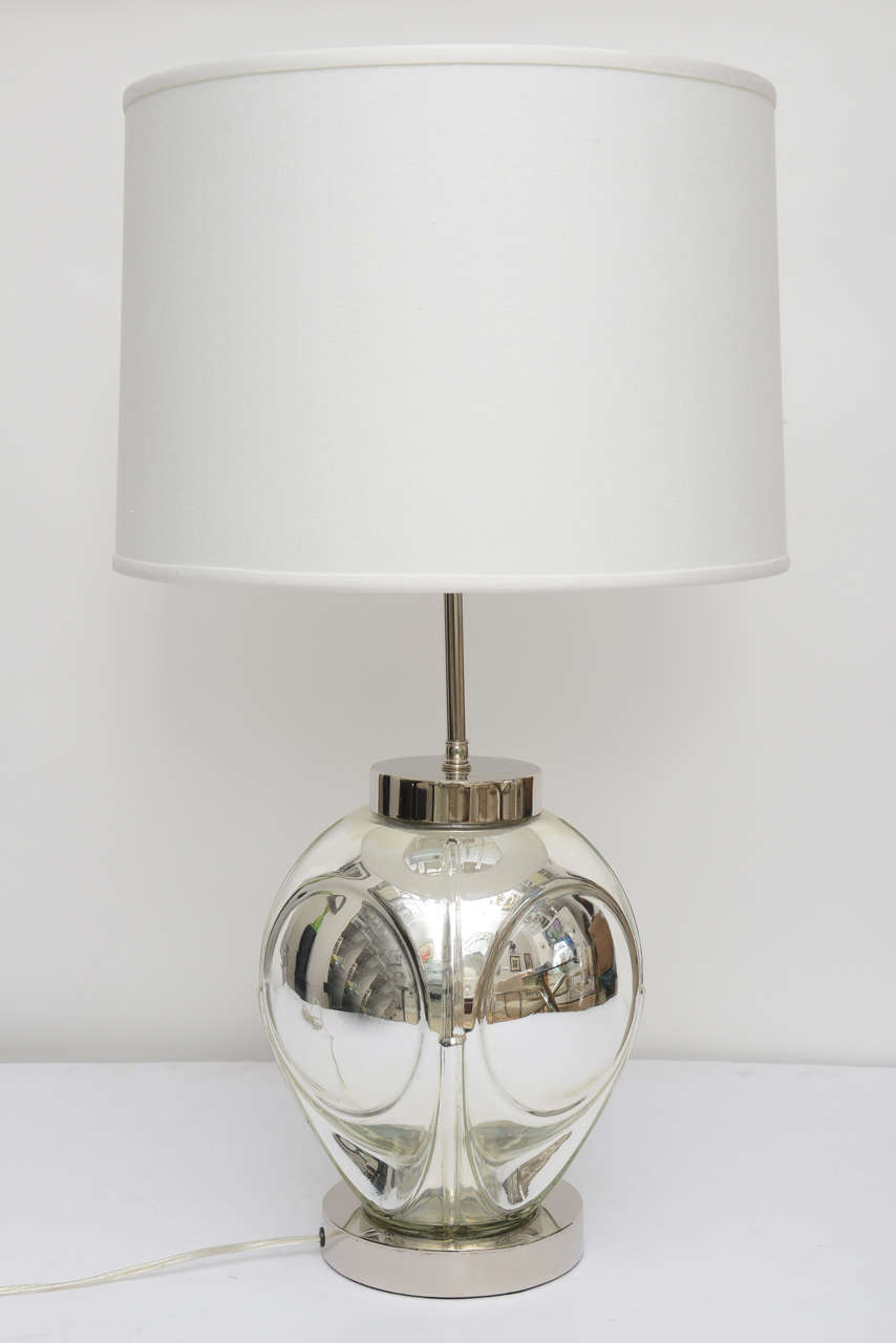 This handsome pair of polished chrome and mercury-glass table lamps date from the 1970s with there optic-bubble detail.  The lamps have double-pull-chain-sockets, an off-white, faux-silk, hard-back shade.

Note: Shade Dimensions   Height 11"