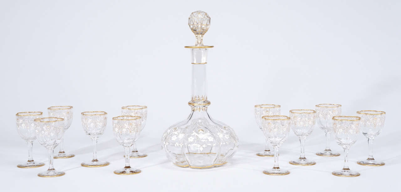 This 13-piece set, made by Moser, circa 1880s is a collector's dream and the perfect way to end a meal. Fill these gorgeous dessert wine goblets with your favorite drink and toast the host. The matching decanter with a facet cut and gilded stopper,