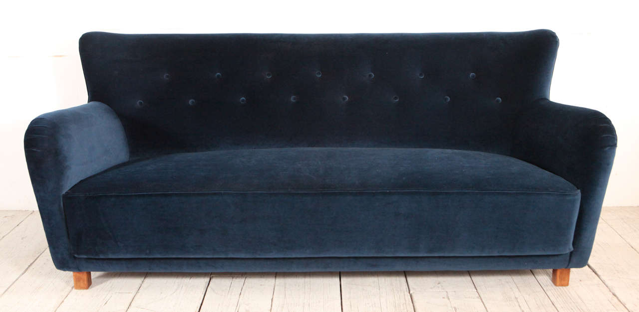 Vintage curved sofa with curved arms and back. Reupholstered in navy velvet.