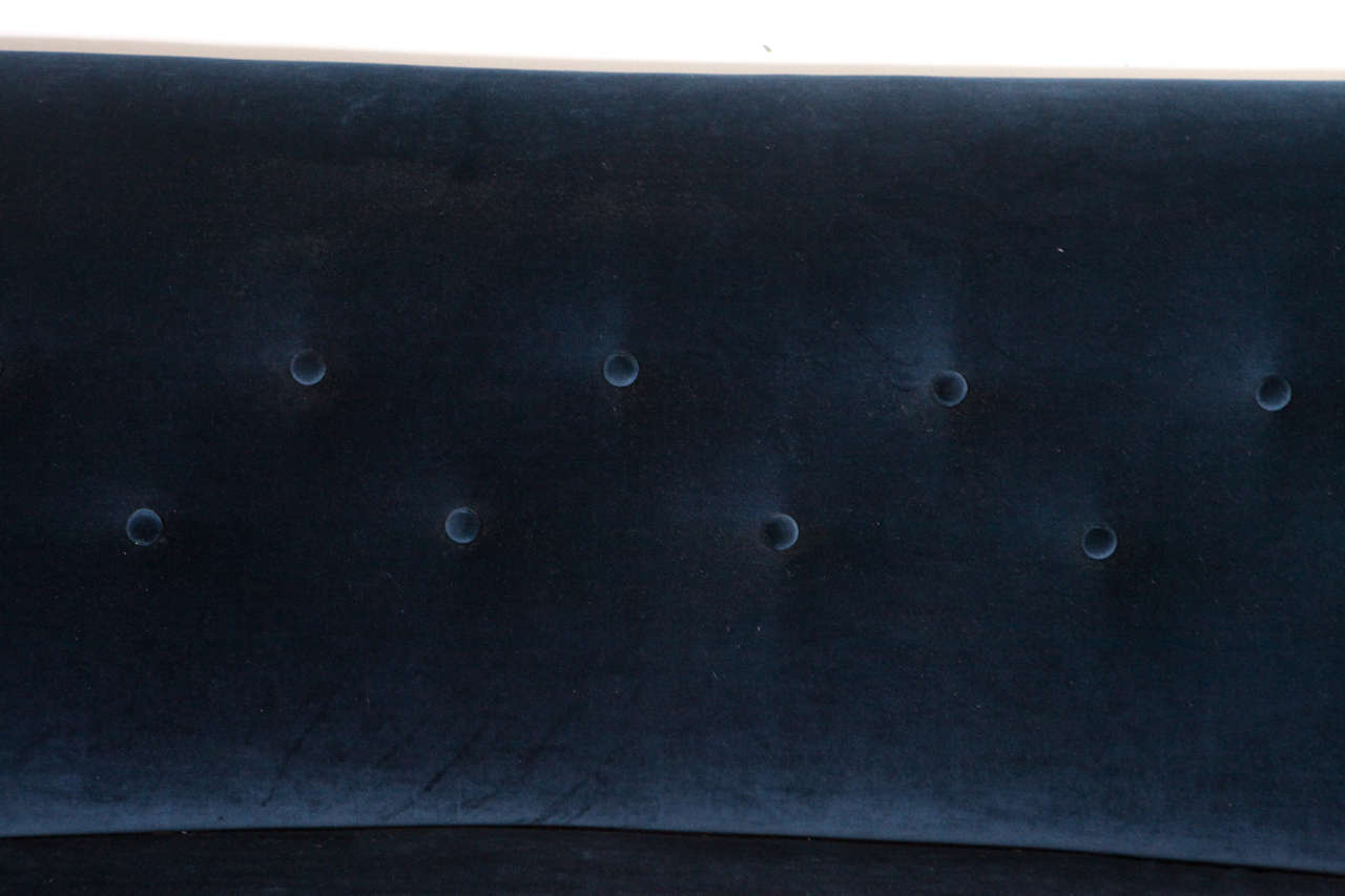 curved tufted sofa