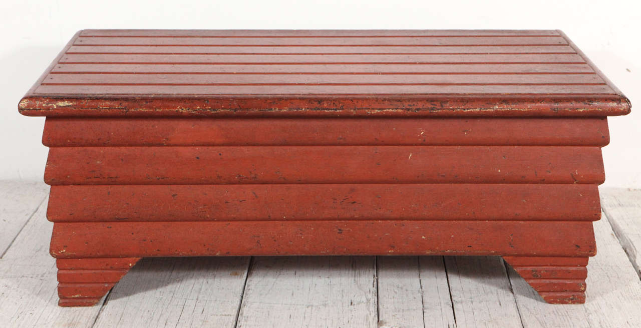 Detailed folk art style layered groove bench.