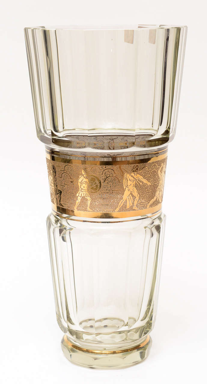 This large fluted baccarat crystal vase  has textural etched gold painted  greco-romanesque
spartan designed thick banded center. The scene has a old world look but a modern feel.
Elegant vase for a elegant home... makes a great holiday gift!!!