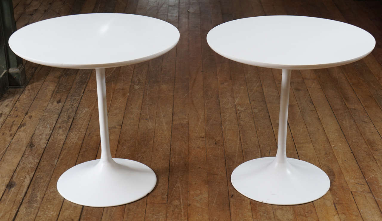 Pair of Mid-Century Modern side tables, metal base, wood top, white surface.