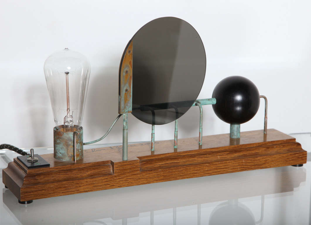 Early 21st Century Edward Zucca Mystery Science #9 Table Lamp, Table Lamp Sculpture. Featuring a stained rectangular White Oak base with Copper, Brass, Ebony, Plexiglas and Edison style light bulb. Artist inspired by 19th century scientific
