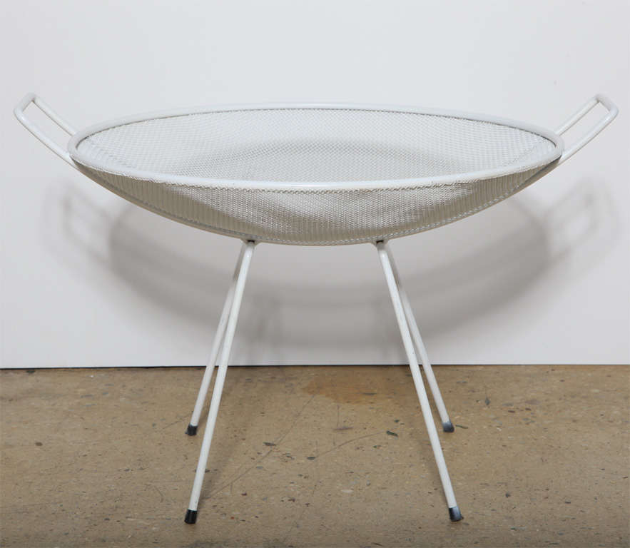 functional Mid Century Sol Bloom All White enameled wire basket form Table, magazine rack with two handles. Great concave multi-use piece. Excellent for holding keys, change, magazines, scarves, clothing, napkins, fruit or whatever you like
