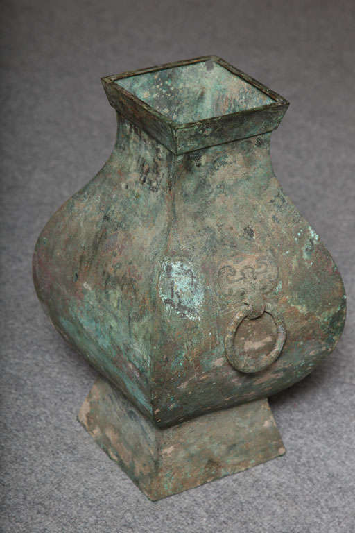 This rare bronze Hu vase of the Chinese Han dynasty was manufactured circa 200 B.C. This excavated ceremonial vessel is an uncommon record of the culture during the Chinese Antiquity. Regarded as the Golden age of China, the Han dynasty