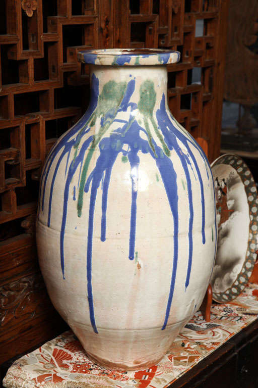 A Japanese 19th century Shigaraki glazed ceramic jar from the Meiji period. This impressive storage jar comes from the Shigaraki kilns in Japan, where it was made in glazed ceramic circa 1850-1870, during the Edo or Meiji period. In accordance with