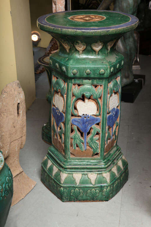 A large French Colonial Art Nouveau style garden ceramic pedestal from the early 20th century. This glazed ceramic garden pedestal is a great example of the Art Nouveau style used in French Southeast Asia, circa 1900. The pedestal is nicely carved