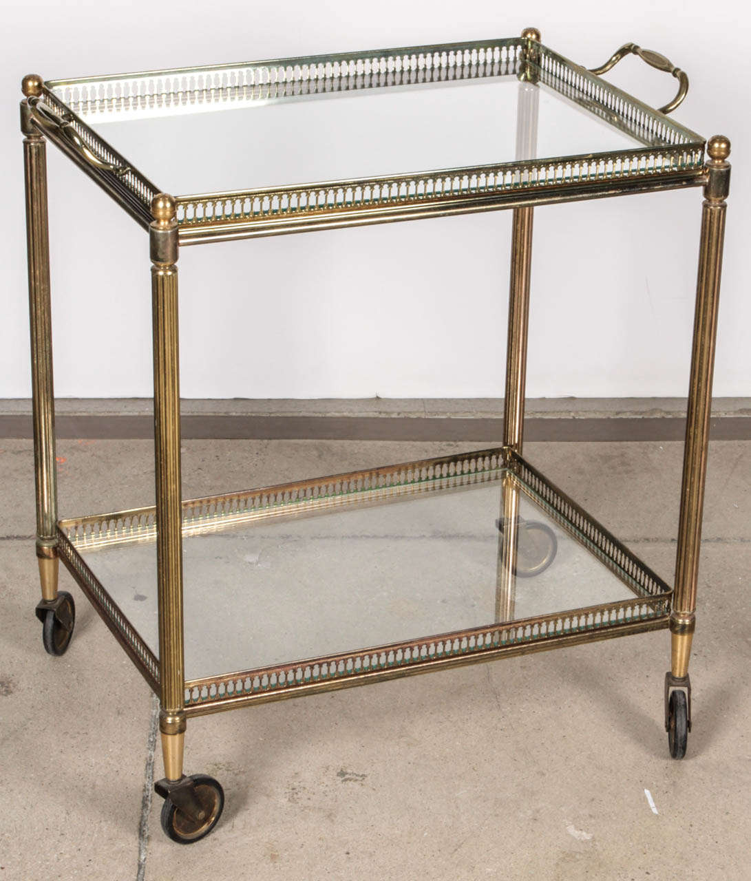 Petite bar cart on wheels with removable tray top.