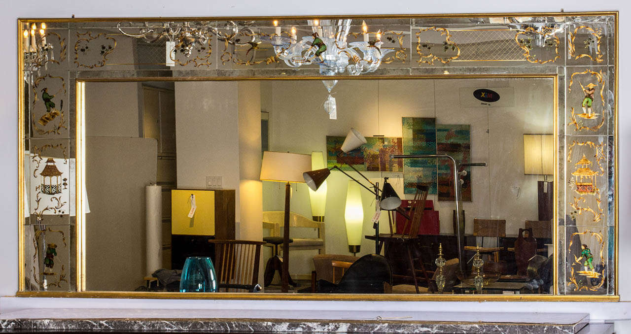 Large French 1940's dining room mirror with reverse painted chinoiserie motif on three sides in brilliant colors. This mirror is a perfect way to open up a room with a whimsical oriental manner.