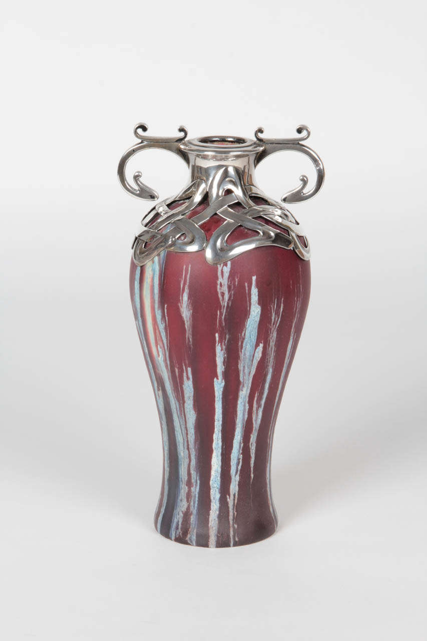 HENRY VAN DE VELDE (1863-1957) Belgium (design mount)
for “LA MAISON MODERNE”  Paris, France
ALPHONSE-EDOUARD DEBAIN  France (execution mount)  
EUGÈNE BAUDIN (1853-1918)  France (pottery)

Vase  c. 1900

Matte-glazed pottery, cranberry