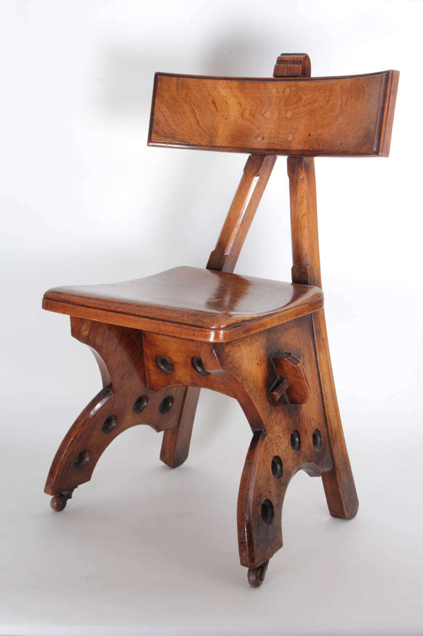 EDWARD WELBY PUGIN  (1834 - 1875) UK

“Granville” chair  c. 1870

Walnut, klismos-style A-frame back with exposed pegs, shaped seat and base with exposed mortise and tenon joinery.

Illustrated: Victorian and Edwardian Decor: From the Gothic