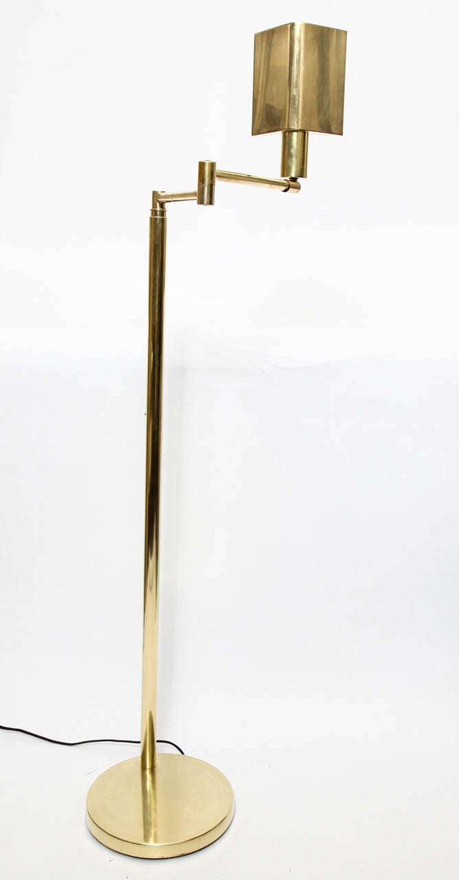 A 1960s articulated brass floor lamp signed Koch & Lowy.