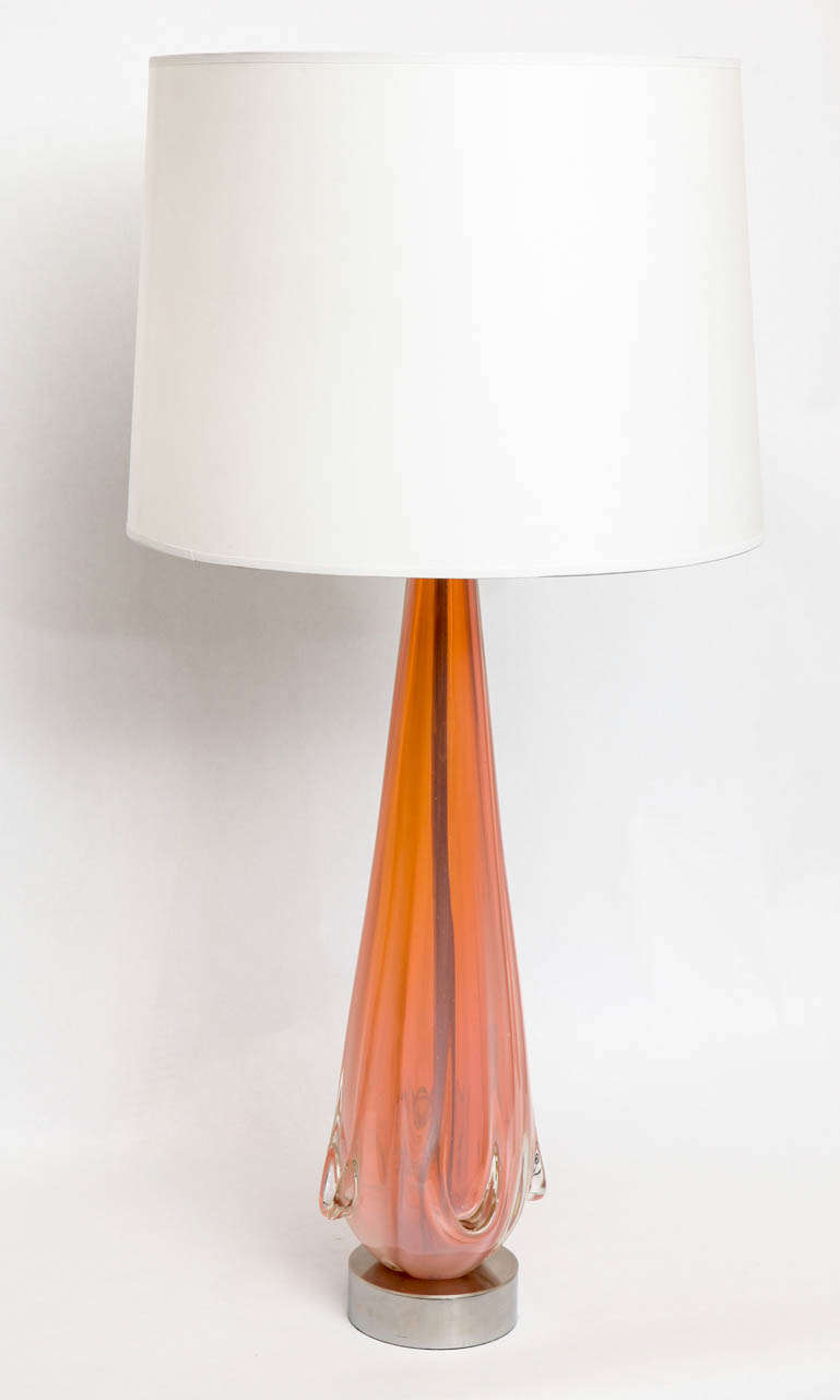 An Italian 1950s sculptural form table lamp, crafted of Murano art glass by Seguso, with silvered brass mounts.