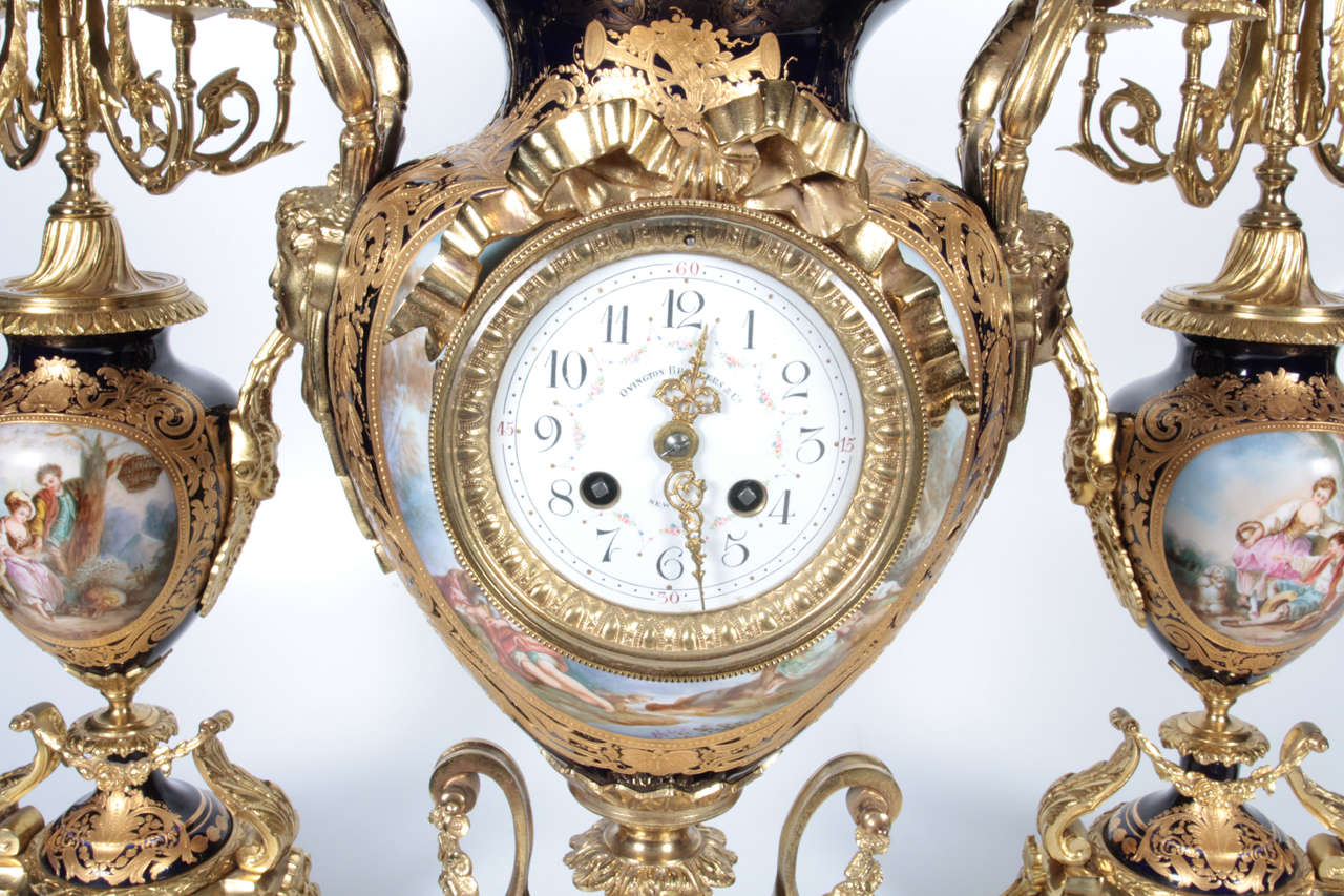 French Ormolu-Mounted Cobalt Sevres Porcelain Three-Piece Clock Garniture, 19th Century