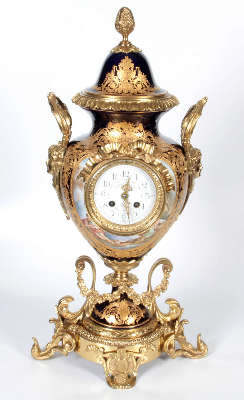 Ormolu-Mounted Cobalt Sevres Porcelain Three-Piece Clock Garniture, 19th Century In Excellent Condition In New York, NY