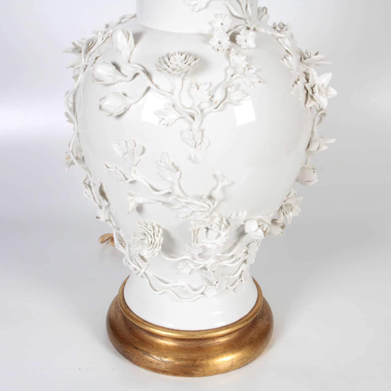 Pair of Antique Blanc de Chine Porcelain Lamps with Raised Flowers at
