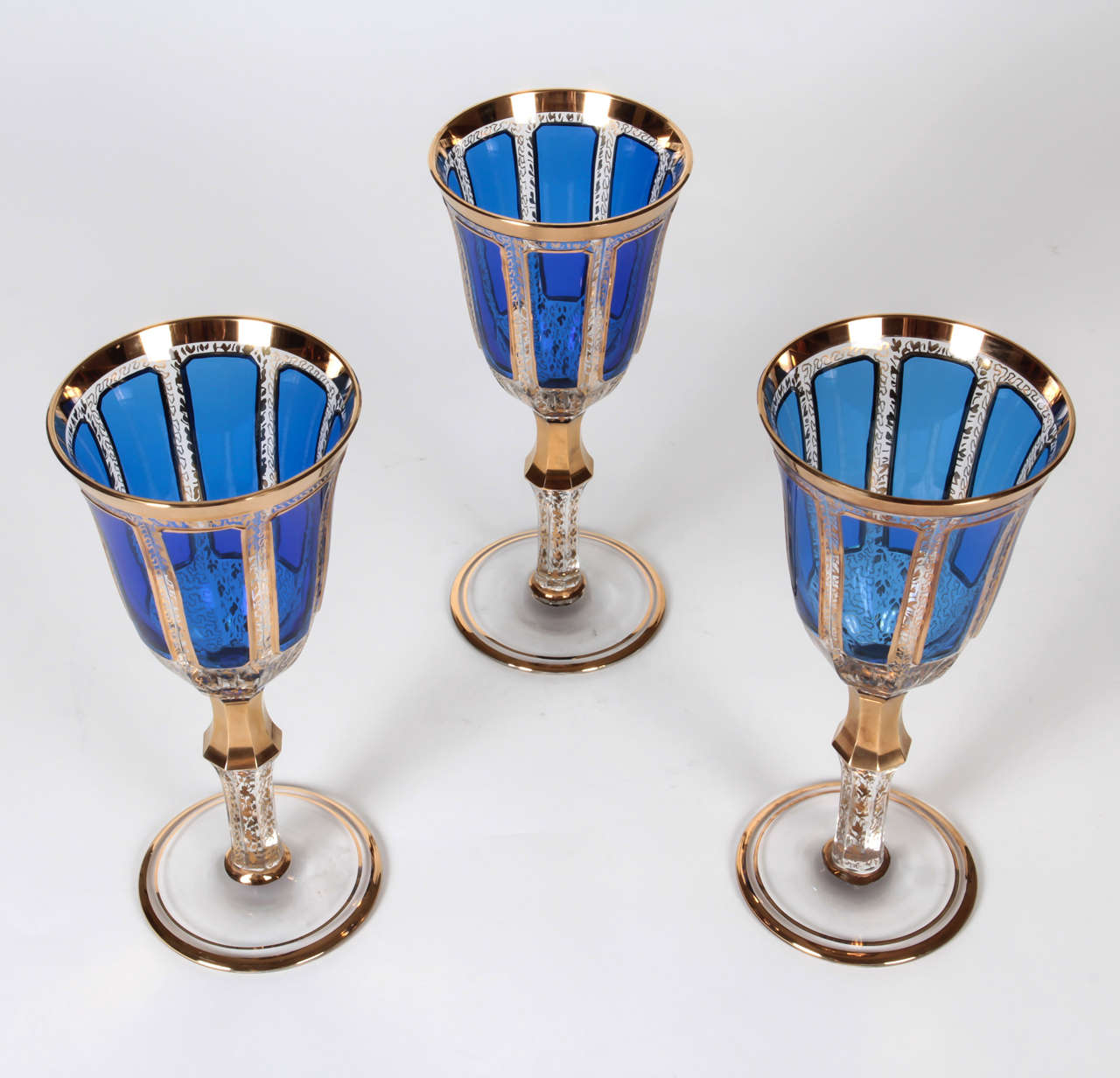 12 Moser, cobalt blue cabochon-style goblets with all-over hand decorated scroll design
