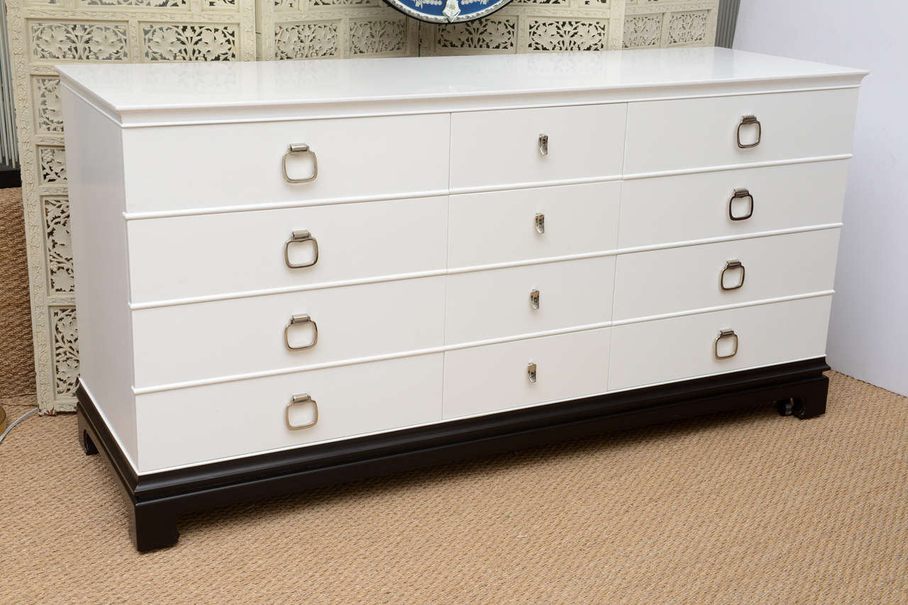 Original 12-Drawer, Asian-Style Dresser by the RWAY Furniture Manufacturing Co., with original client tag in tact.  Makers mark.   Newly refinished in a satin lacquer white with brown mahogany finish to Asian-motif on legs and base surround.  