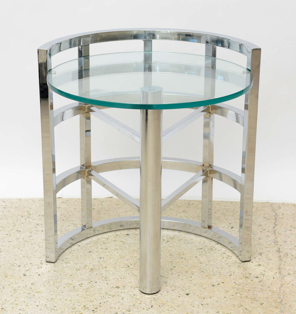 The chrome frame with a cylinder and arms that connect to a 