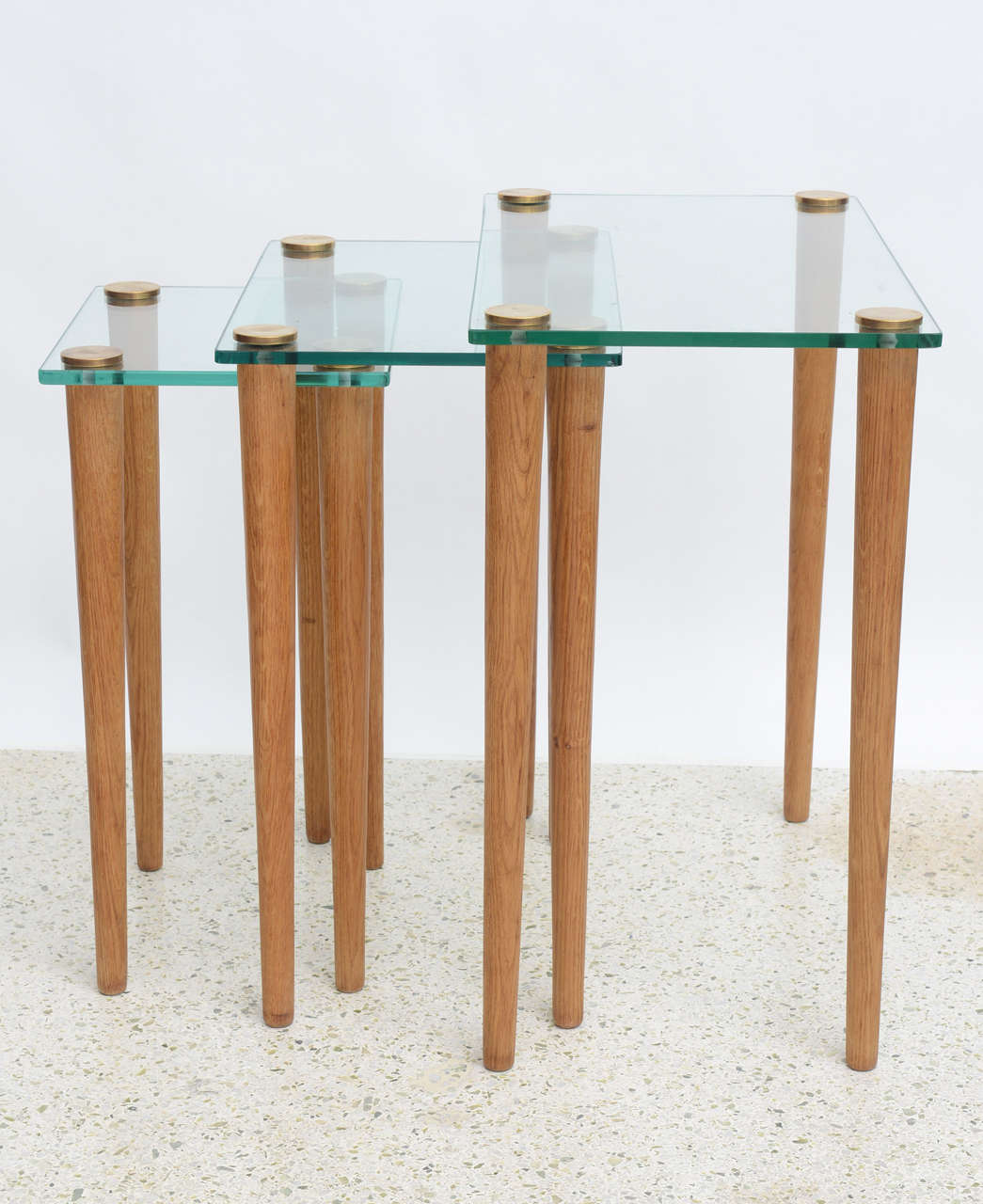 Mid-20th Century American Modern Set of Walnut, Brass and Glass Nesting Tables, Gilbert Rohde