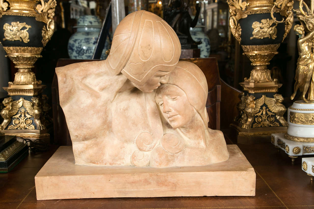 Depicting lovers, this period deco terra cotta sculpture is signed Harriette G. Miller with the copyright date of 1928. Ms, Miller was born in Cleveland in 1892. She lived most of her adult life in Arlington, Vermont. She studied at the Cleveland