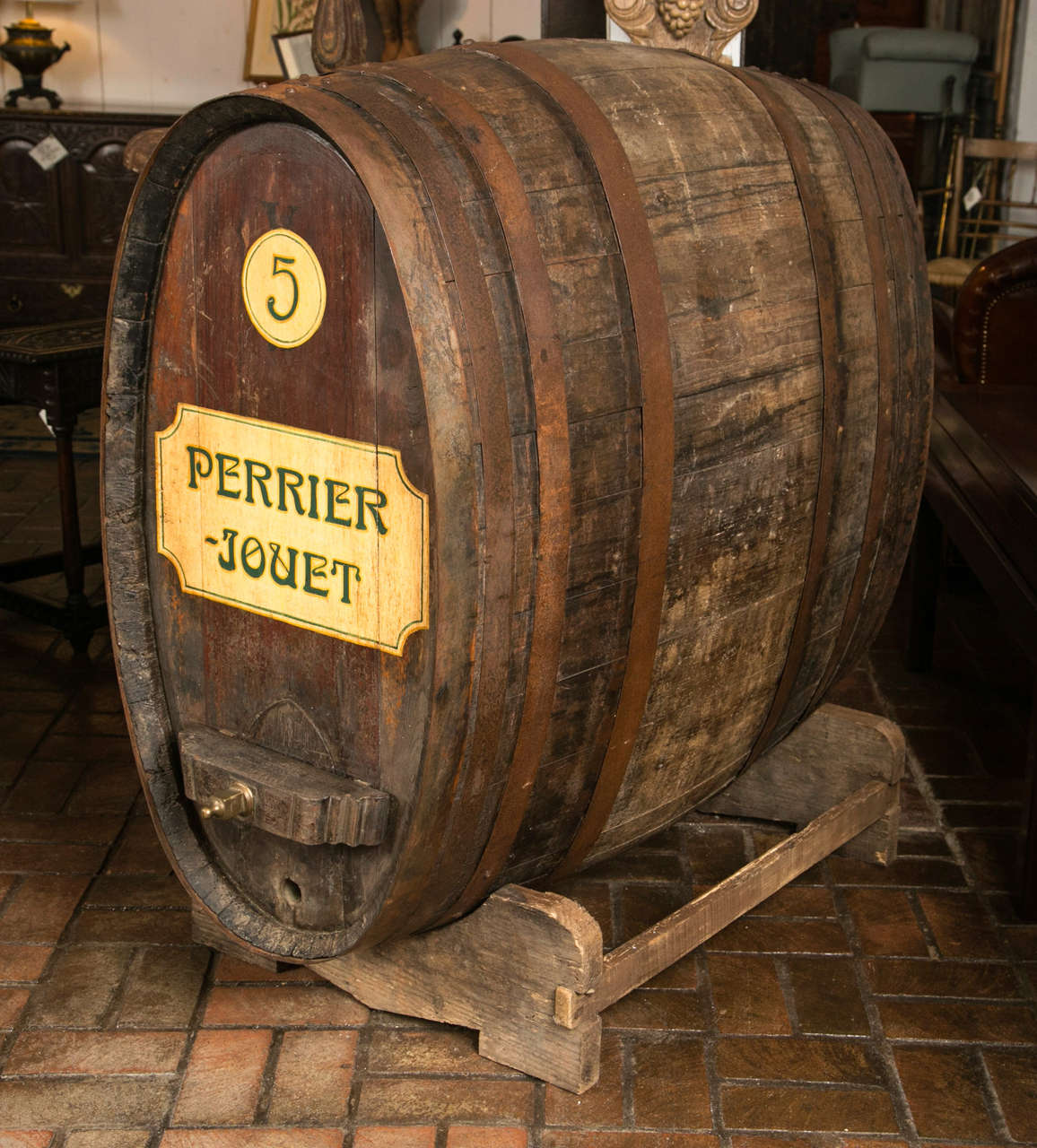 This 300+ liter, oak wine barrel has aged almost as well as the wine it once held. Its impressive size and patina makes for a delightful conversation piece and the Perrier-Jouet painted decoration only adds to the topic of fine wines. On a heavy