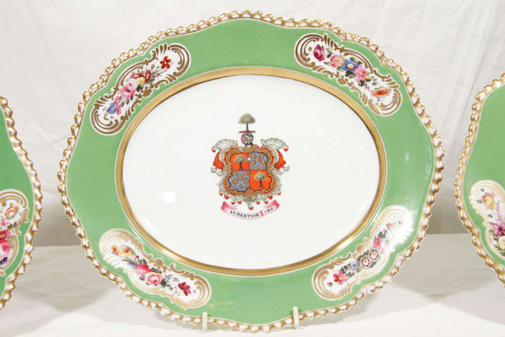 A pair of dishes and an oval platter with armorial and motto 