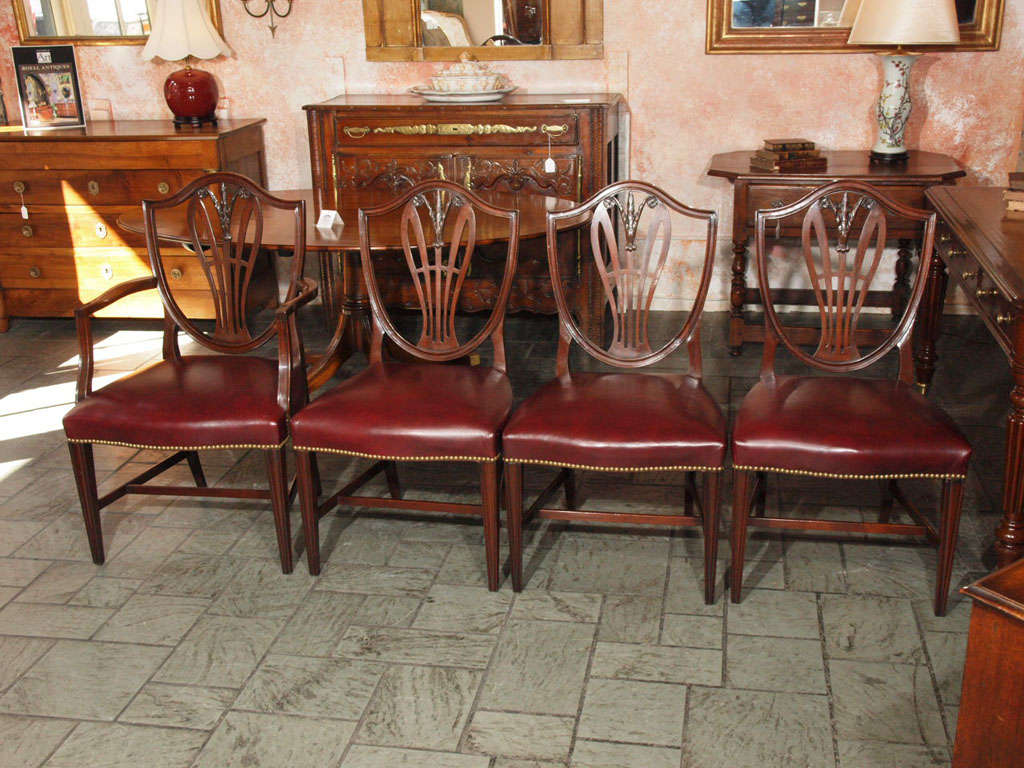 Set of 8 English Prince of Wales mahogany leather covered dining chairs.
