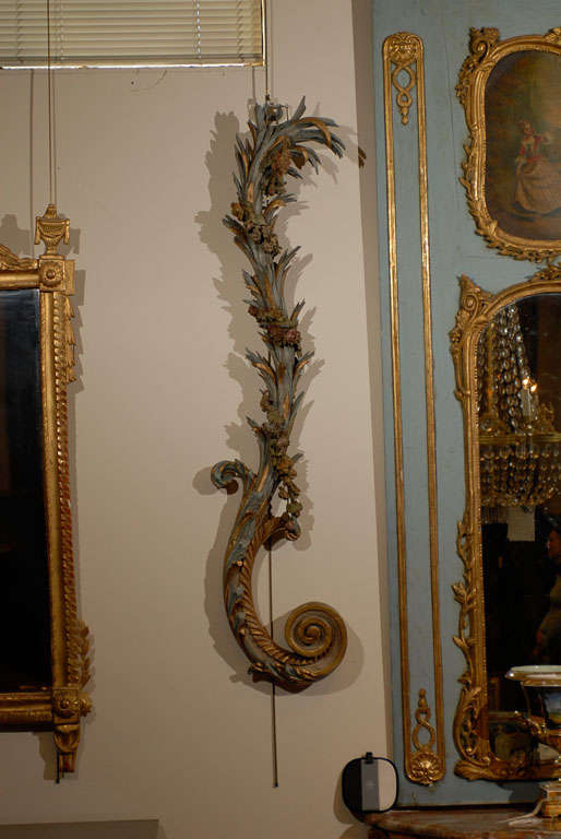 Pair of Painted and Parcel Gilt Architectural Scroll Carvings with Flower Garlands and Acanthus Leaf Detail, Continental in Origin and dating from the turn of the 20th century.

For many more fine antiques, including works of art and furniture from