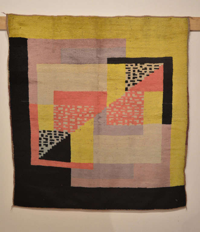 Distinguished by the Cubist style characteristic of the Art Deco carpets of leading designers such as Ivan Da Silva Bruhns, this square rug displays the whimsical colour contrasts that are quite typical of the early phase of Art Deco weavings, which