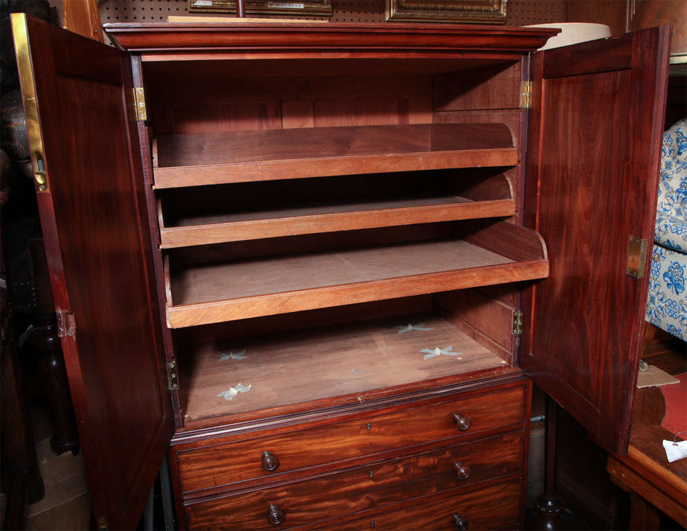 Beautiful colored mahogany with storage for clothing.

Made by furniture makers Gillows of Lancaster.