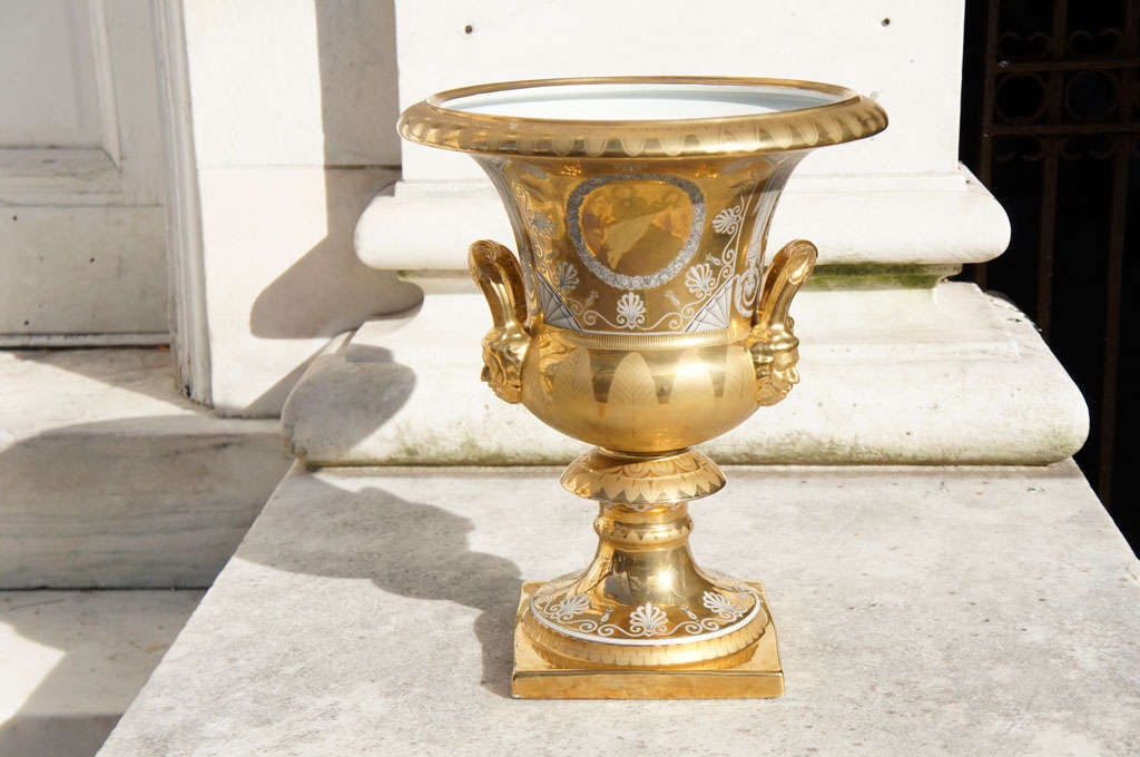 This massive urn of almost palace size is a stunning example of the late work created in France and sold to enhance the growing upper class of the time. Decorated on one side with a large floral painting and on the other with a laurel wreath