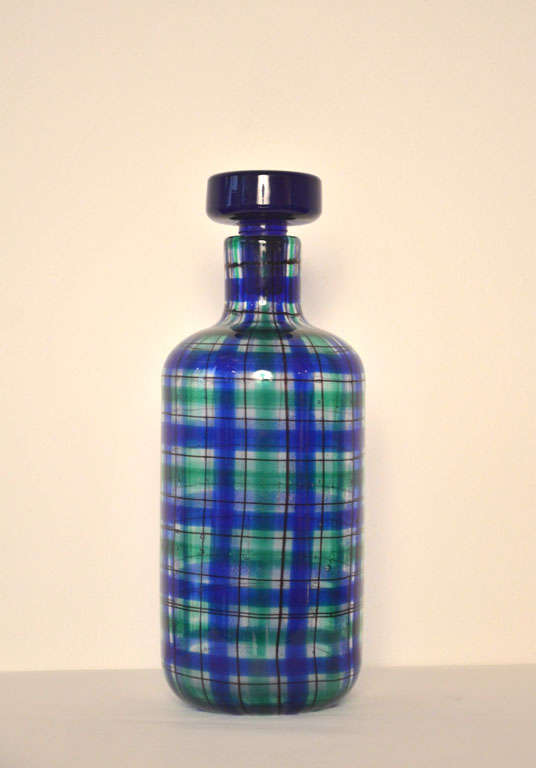 Bottle with stopper in green, blue and transparent blown glass from the series 