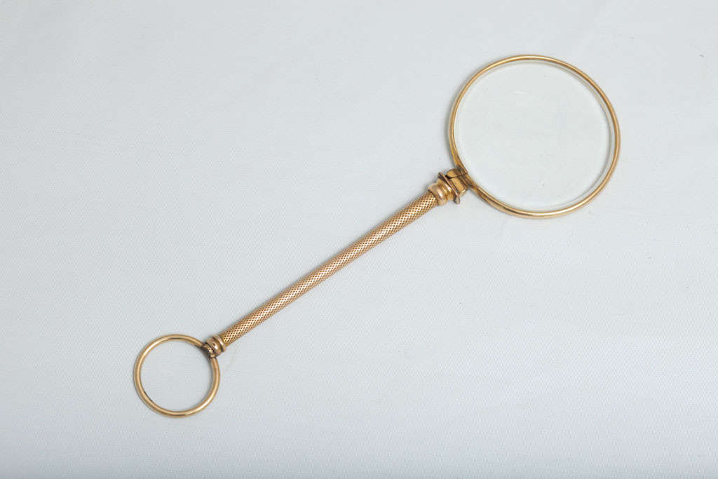 Edwardian, 9-carat gold (unmarked, but tested) magnifying glass, England, circa 1910. Measures: 5 1/4