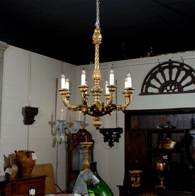 A gilt-wood chandelier with 8 lights and twisted arm detail. 

William Word Fine Antiques: Atlanta's source for antique interiors since 1956.