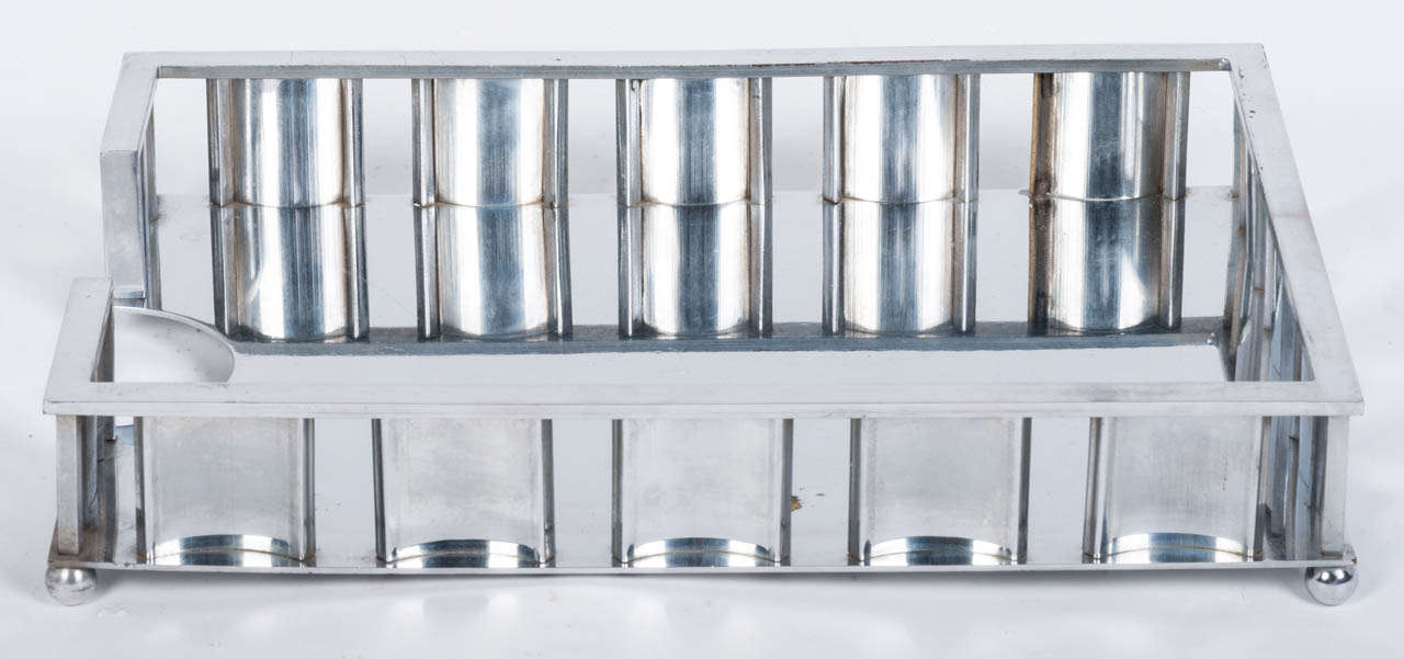 Jacques Adnet & the Compagnie des arts Français rare letter tray. Chromed metal, perforated edges, consisting of a series of vertical blades curved body resting on spherical feet. Circa 1930