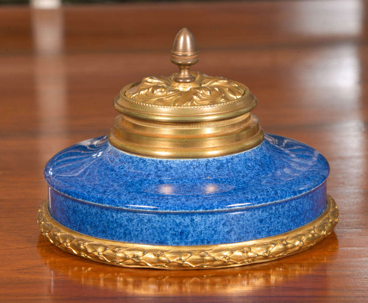 French Sevres pottery gilt bronze inkwell, circa 1900. The metal and pottery are in excellent condition with no damage. The pottery is a mottled blue glaze that has varying shades of blue. This is truly an outstanding piece and would be a fabulous