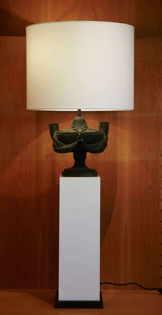 Pair of table lamps with bronze cups mounted over a white plexiglas column & metal base. 
White cotton drum shades.